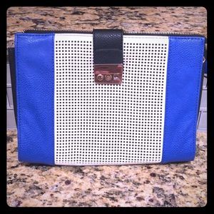 Royal blue, cream, and black clutch